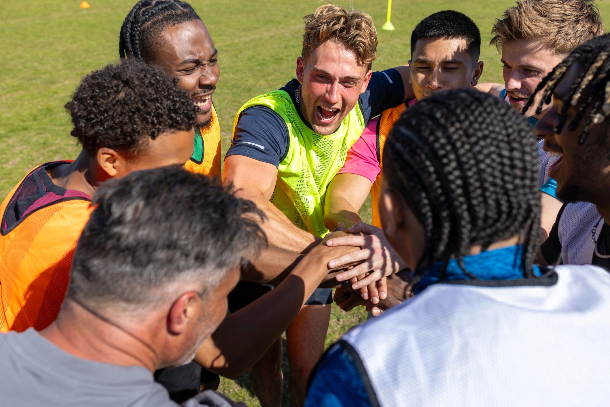 Team huddle representing collaboration and customer partnership